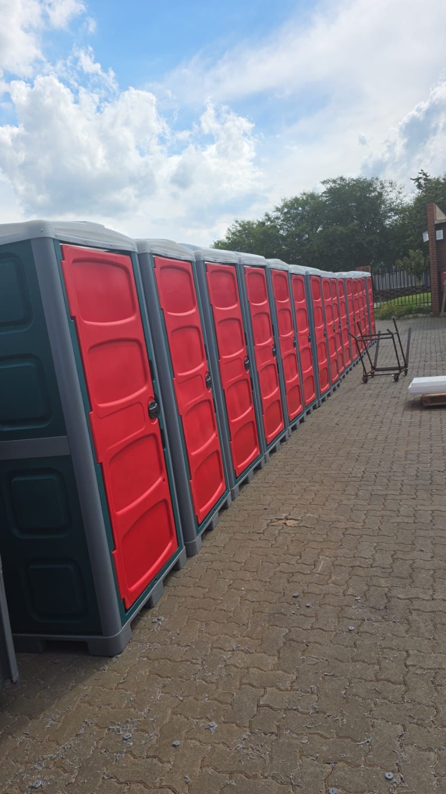 A row of portable mobile toilets